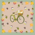 Green bike with autumn flowers in a basket, mushrooms, fir coones and nuts